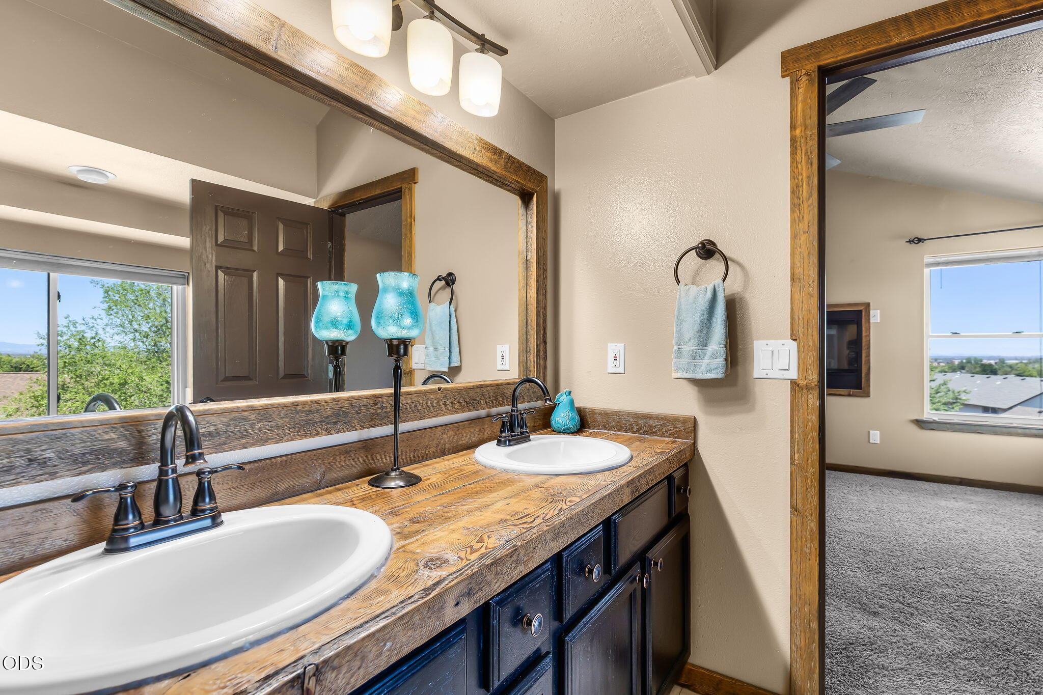 2486 Southwest Valleyview Drive Redmond, OR 97756 - Photo 34 of 55 a bathroom with a granite countertop sink and a mirror