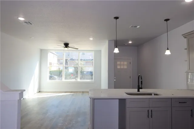 a view of a kitchen center island and windows
