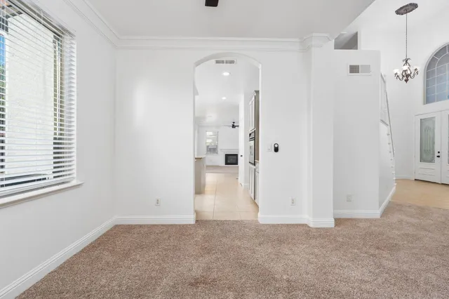 a large kitchen with kitchen island granite countertop a large counter top a sink stainless steel appliances and cabinets