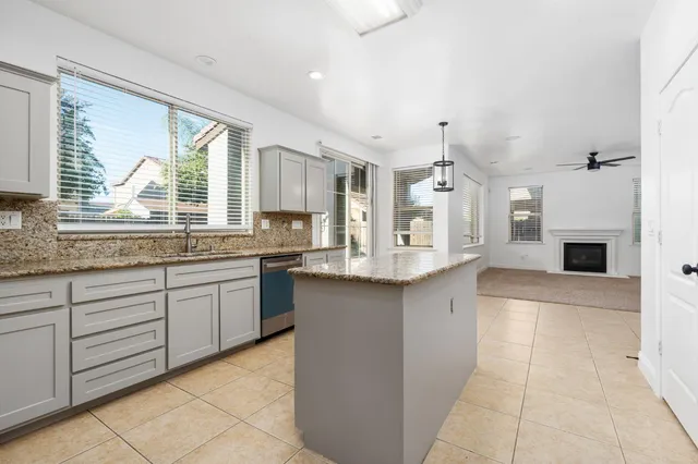 a kitchen with cabinets appliances and a sink