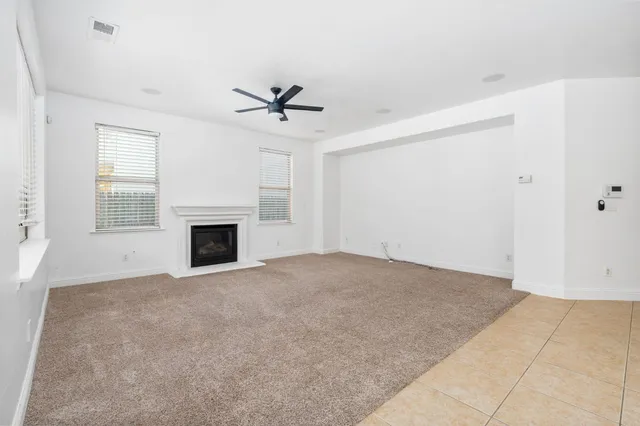 a view of a kitchen with a sink and a window
