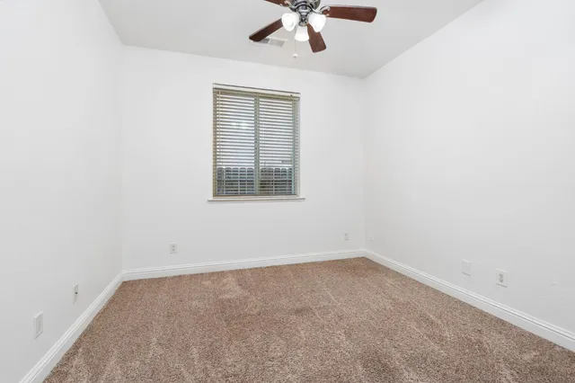 an empty room with fan