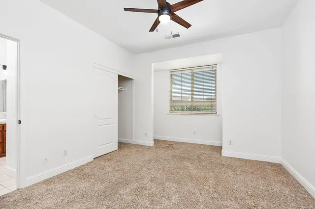 a white toilet sitting next to a bath tub