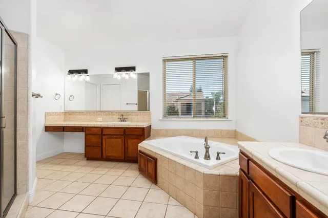 a bathroom with a shower and a sink