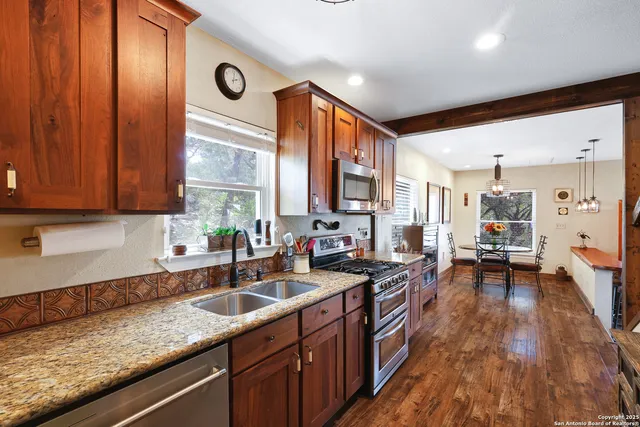 a view of living room with furniture and a flat screen tv