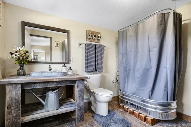 a view of a bedroom with washer and dryer