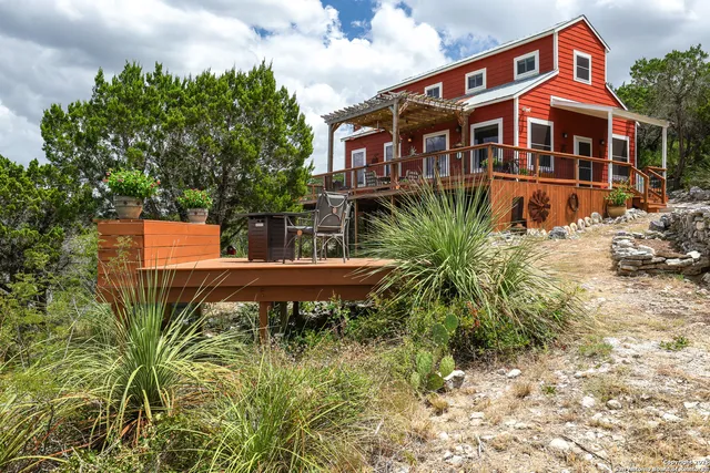 a view of a chairs and table in a patio