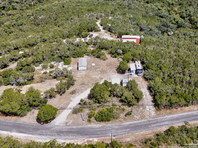 an aerial view of residential house with outdoor space