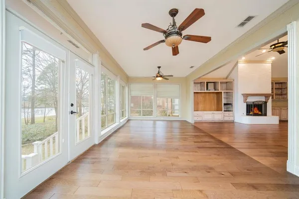 a view of a livingroom with a ceiling fan and window