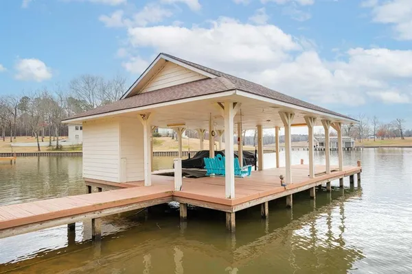 a small white and wooden roof deck
