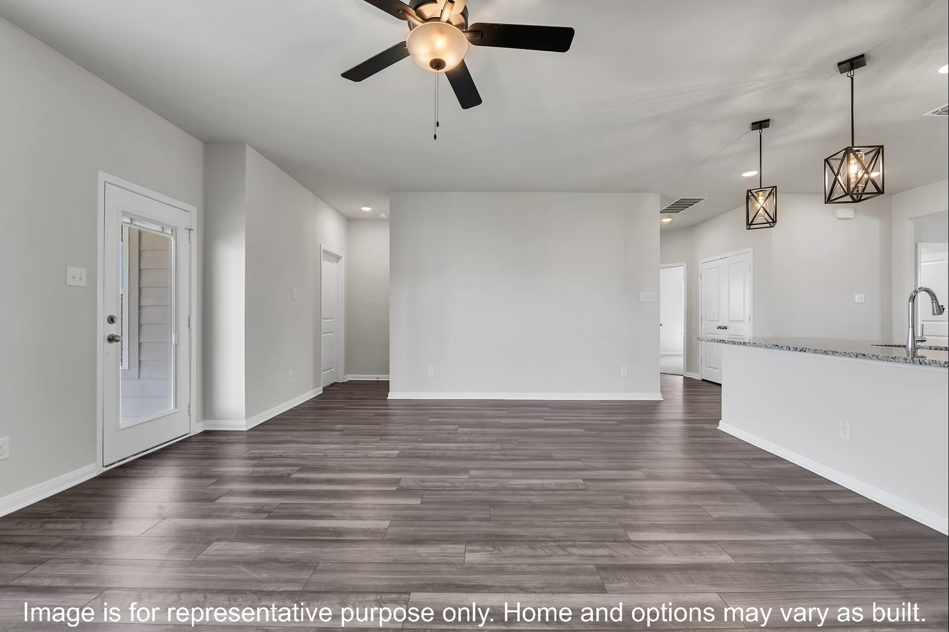 237 Lazy Lizzy Road Jarrell, TX 76537 - Photo 18 of 18 An open floorplan seamlessly connects the main living area to the kitchen.