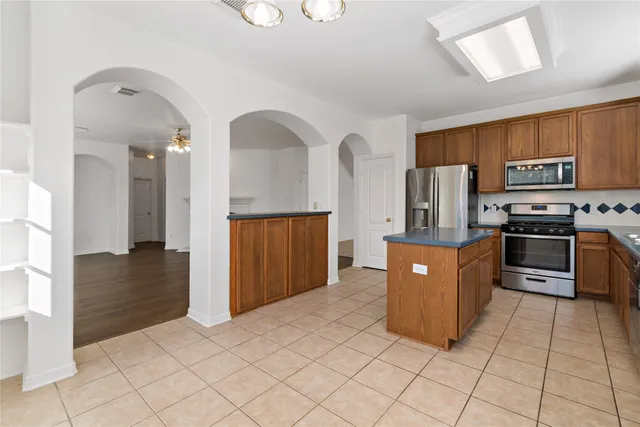 a bedroom with a bed and a lamp