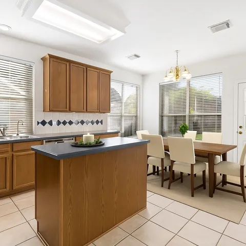 a living room with furniture a flat screen tv and a large window