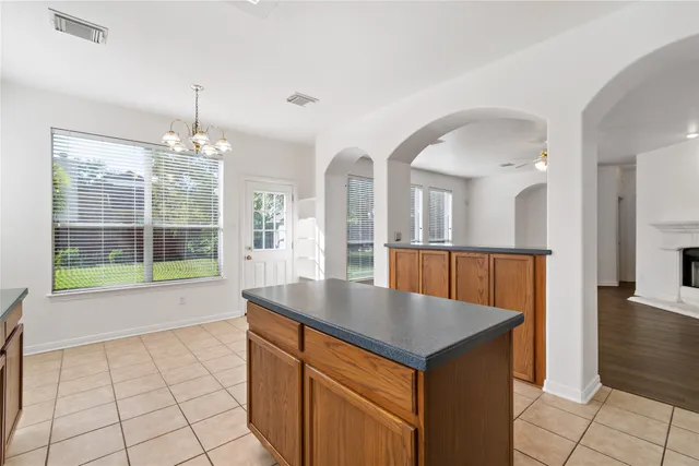 a view of a livingroom with a ceiling fan and window