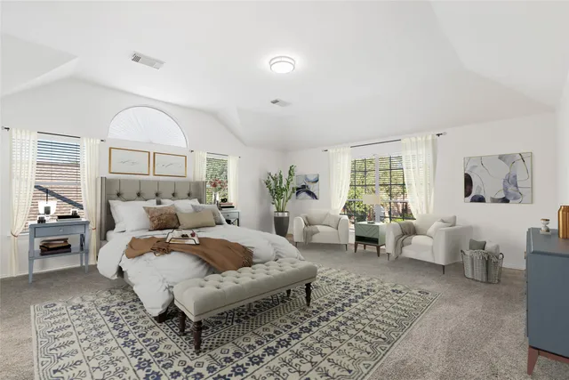 a spacious bathroom with a double vanity sink and mirror