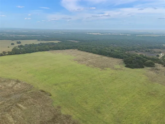 a view of an ocean beach and mountain