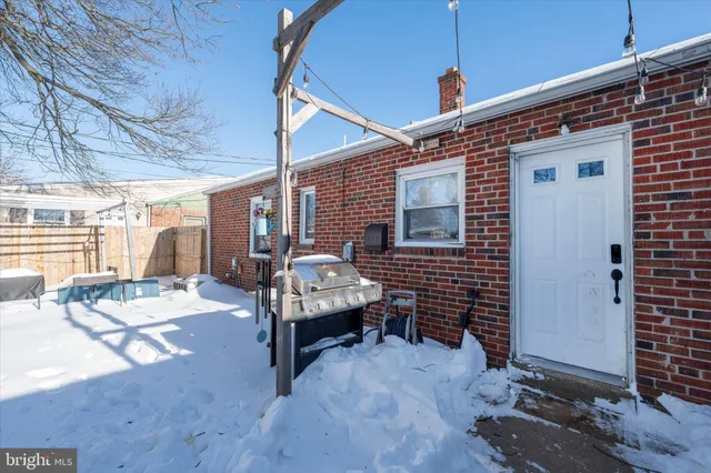 a view of a patio with table and chairs and wooden floor