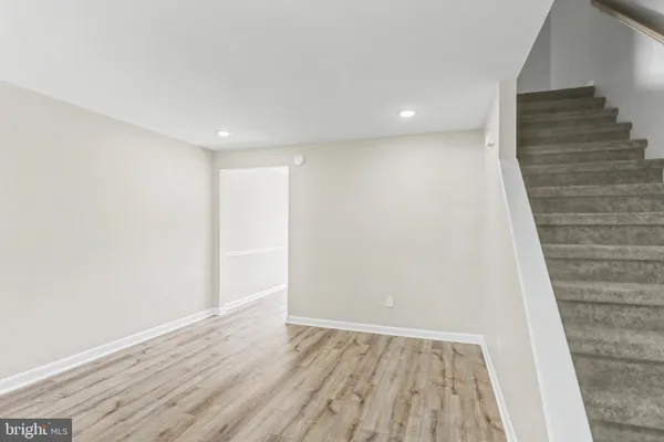 a view of hallway with wooden floor
