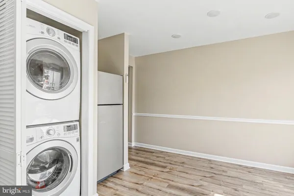 a view of a hallway with washer and dryer