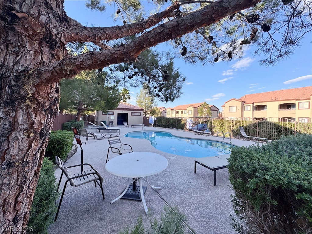 9580 West Reno Avenue, Unit 242 Las Vegas, NV 89148 - Photo 25 of 26 A tranquil community pool, provides a serene escape with ample seating.