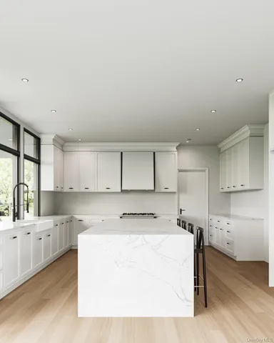 a view of kitchen with wooden floor