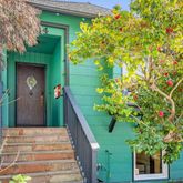 a sign that is sitting in front of a house