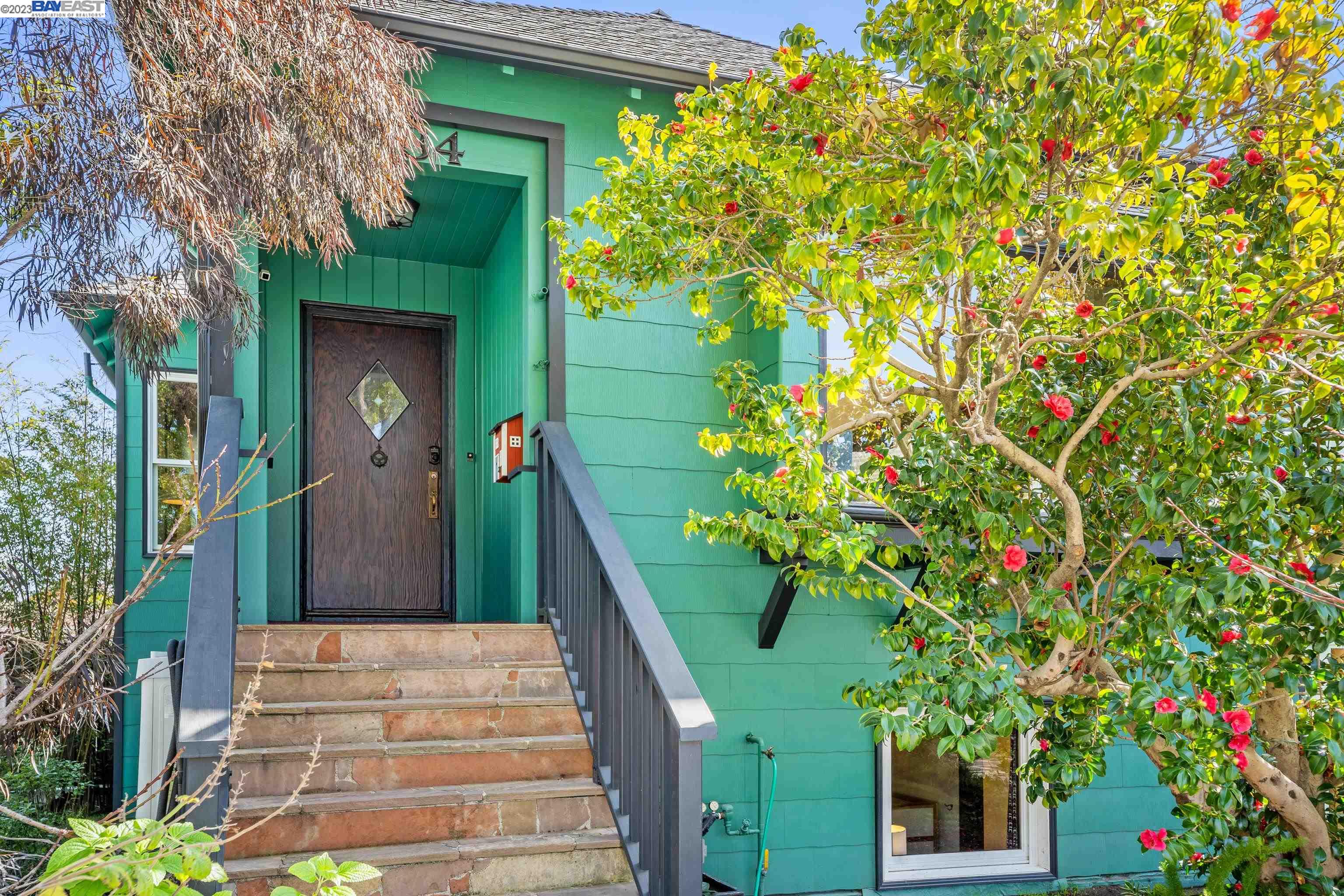 a sign that is sitting in front of a house