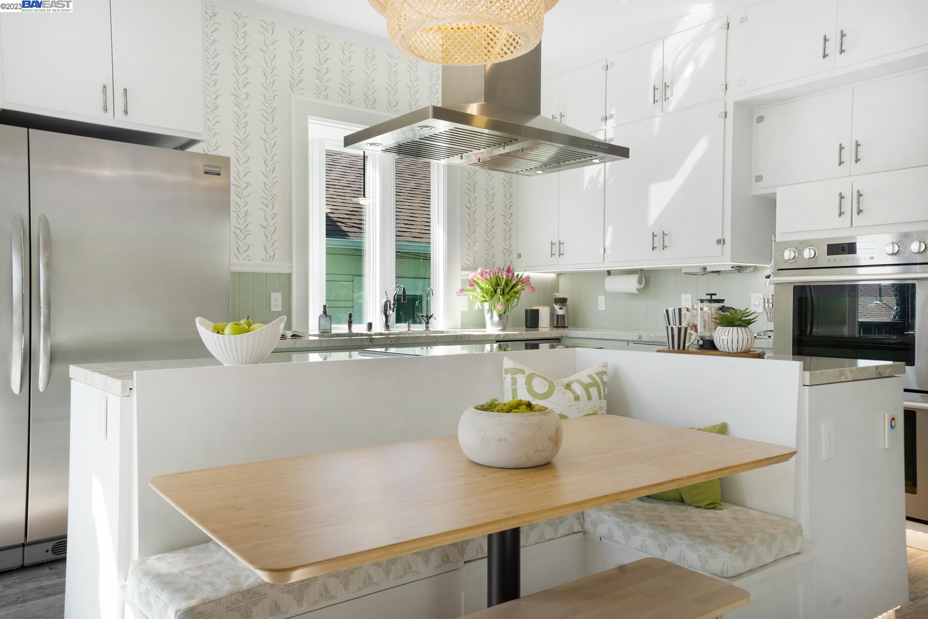 Undisclosed Address Alameda, CA 94501 - Photo 12 of 50 a kitchen with a sink a stove and white cabinets