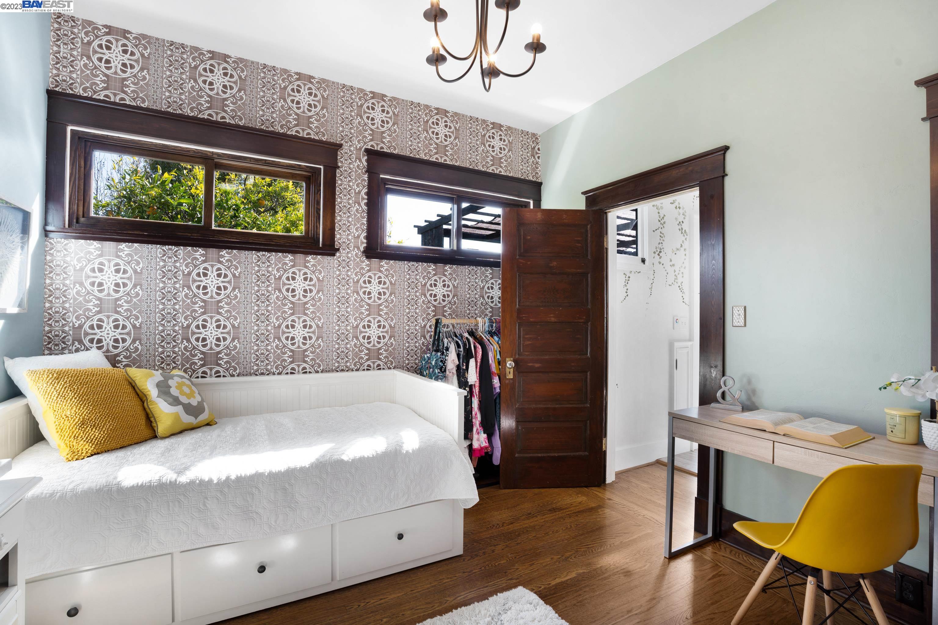 Undisclosed Address Alameda, CA 94501 - Photo 16 of 50 a bedroom with a bed a dresser and chair