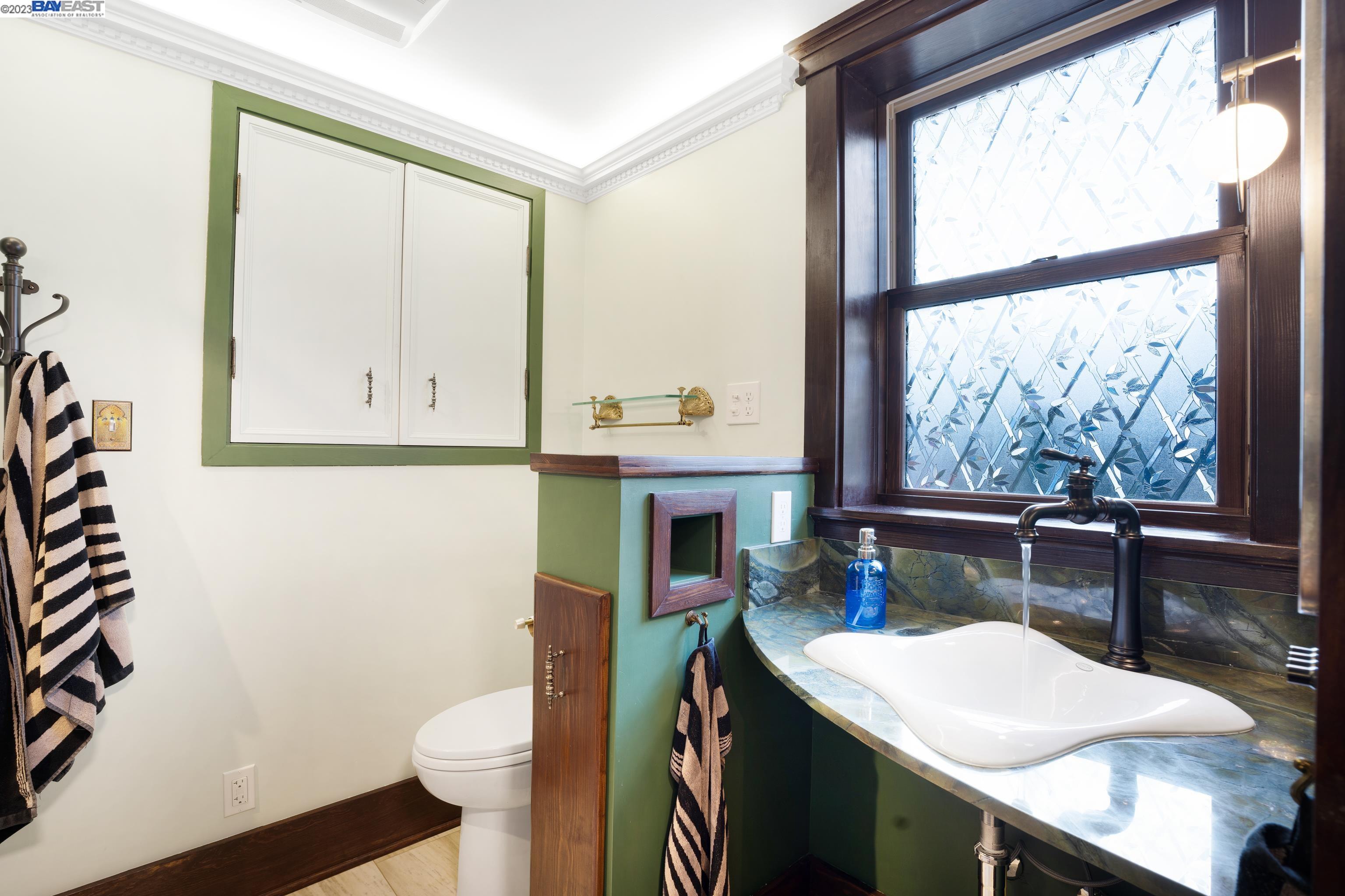 Undisclosed Address Alameda, CA 94501 - Photo 20 of 50 a bathroom with a sink a toilet and a window