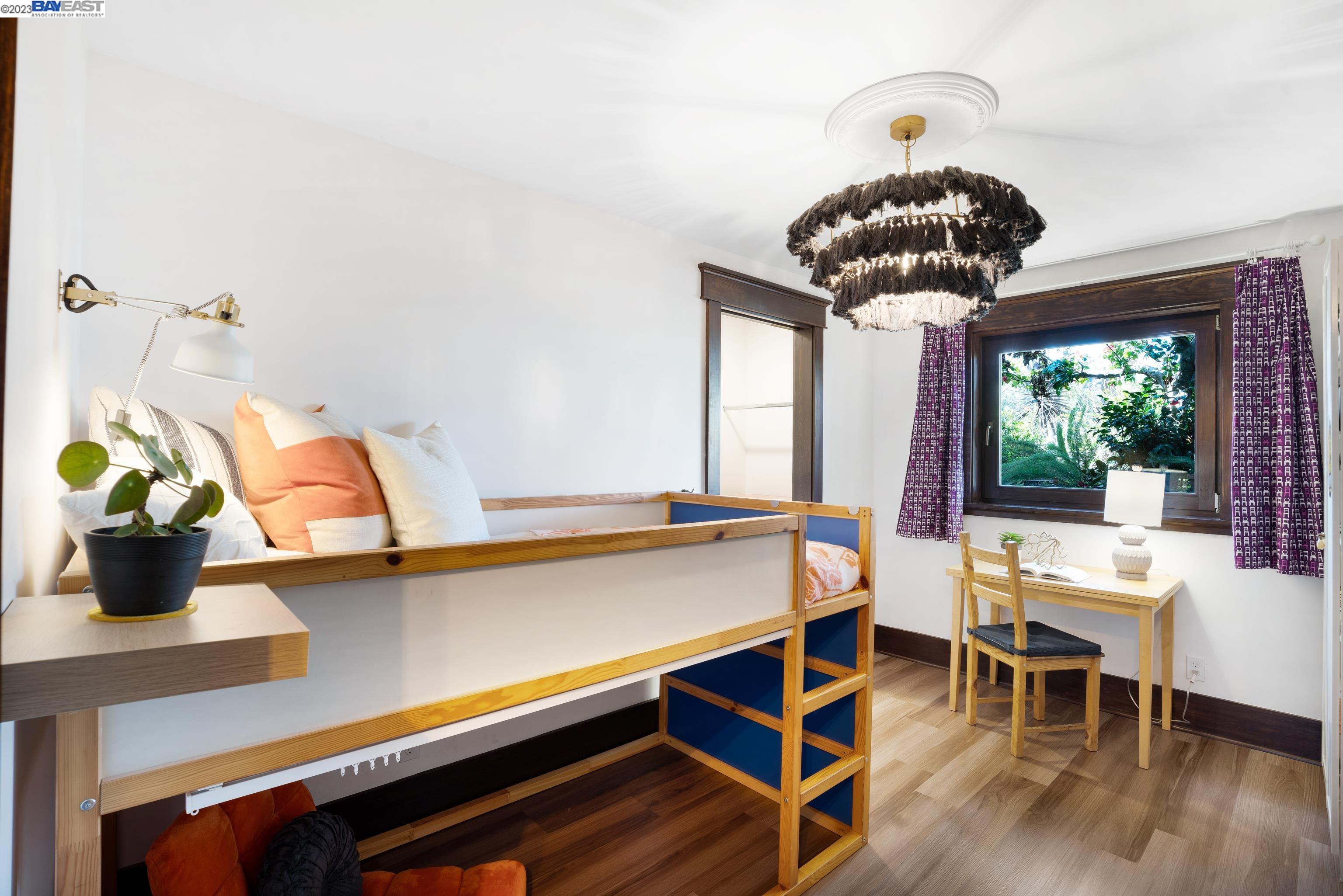 Undisclosed Address Alameda, CA 94501 - Photo 22 of 50 a room with a table and a chandelier