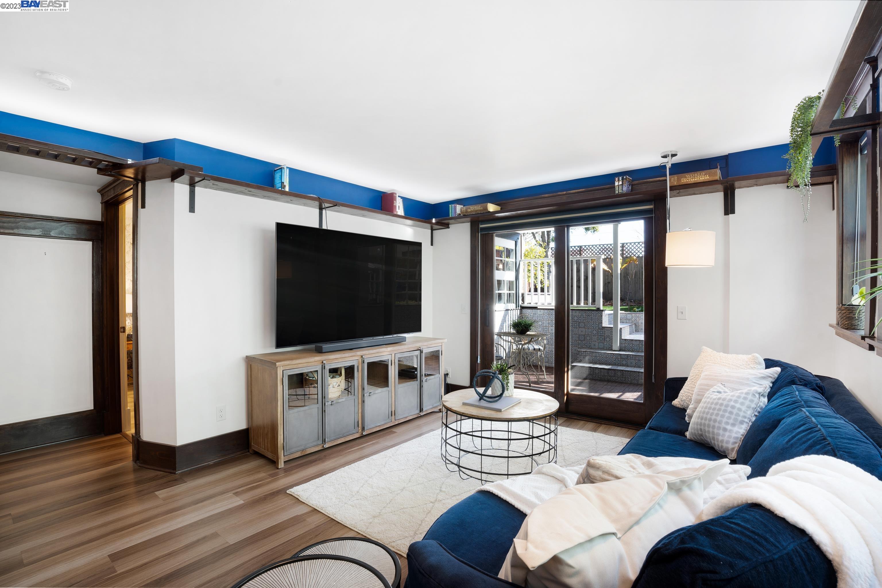 Undisclosed Address Alameda, CA 94501 - Photo 27 of 50 a living room with furniture and a flat screen tv