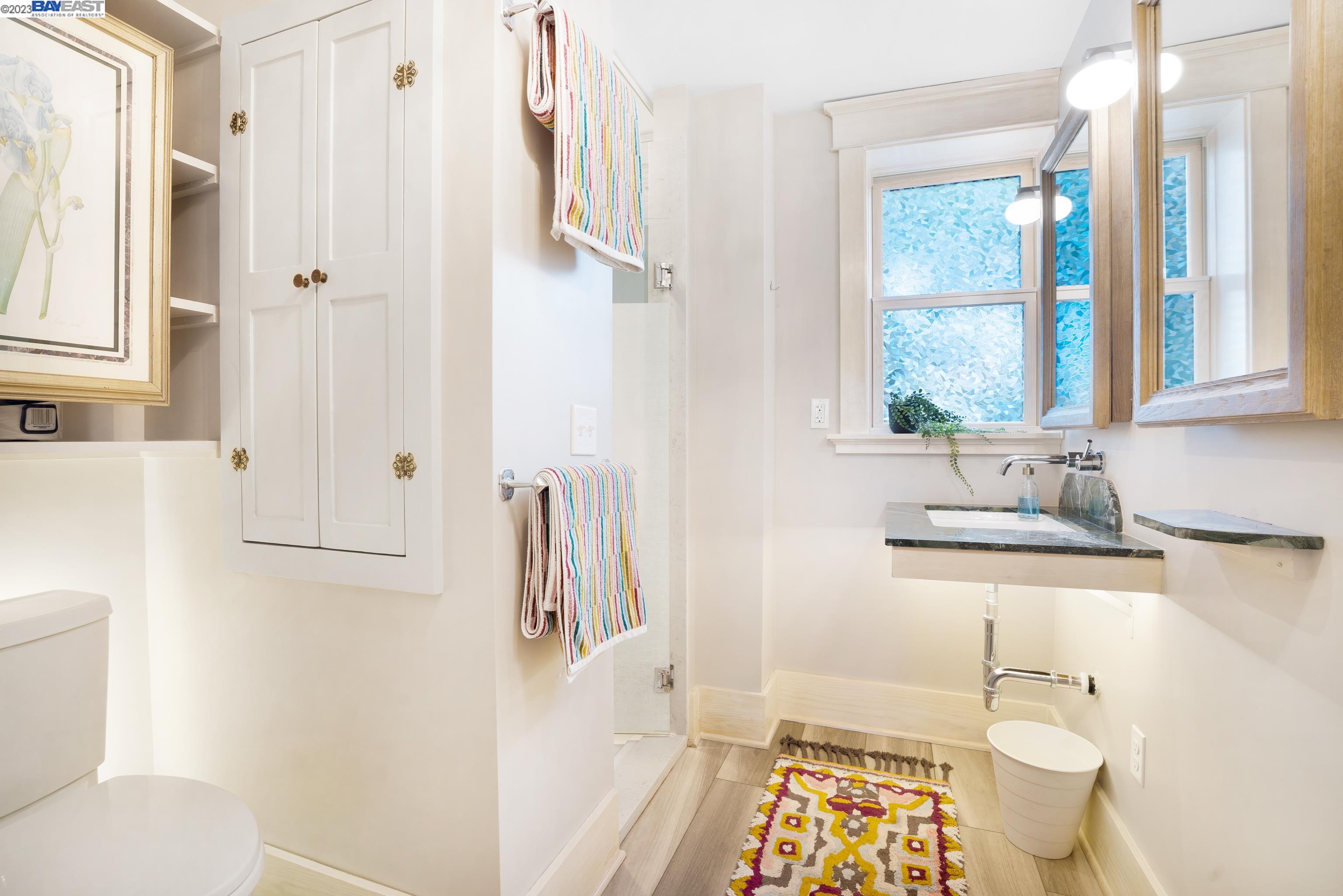 Undisclosed Address Alameda, CA 94501 - Photo 29 of 50 a bathroom with a sink toilet and shower