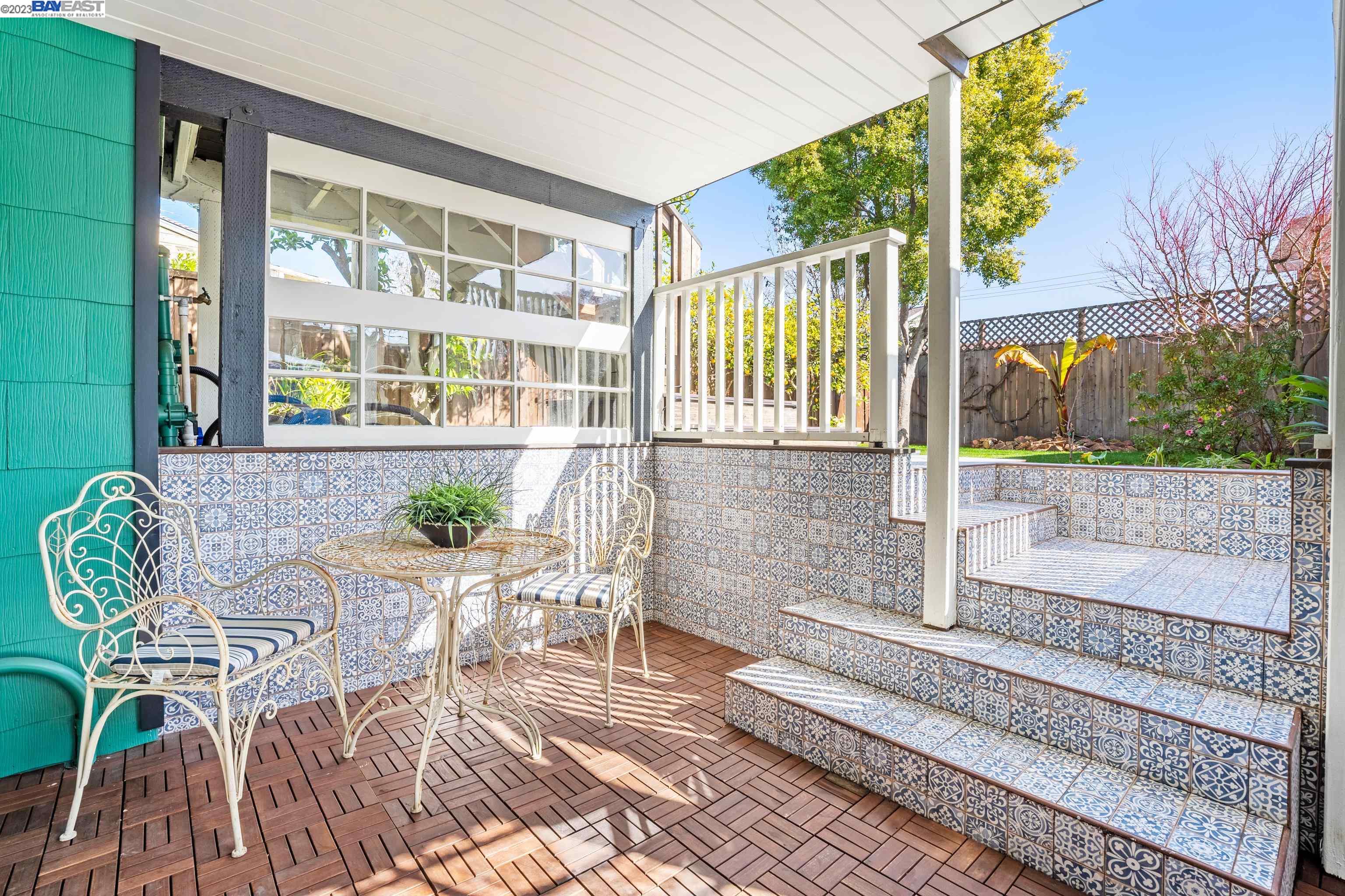 Undisclosed Address Alameda, CA 94501 - Photo 32 of 50 a view of a patio with a table and chairs and potted plants