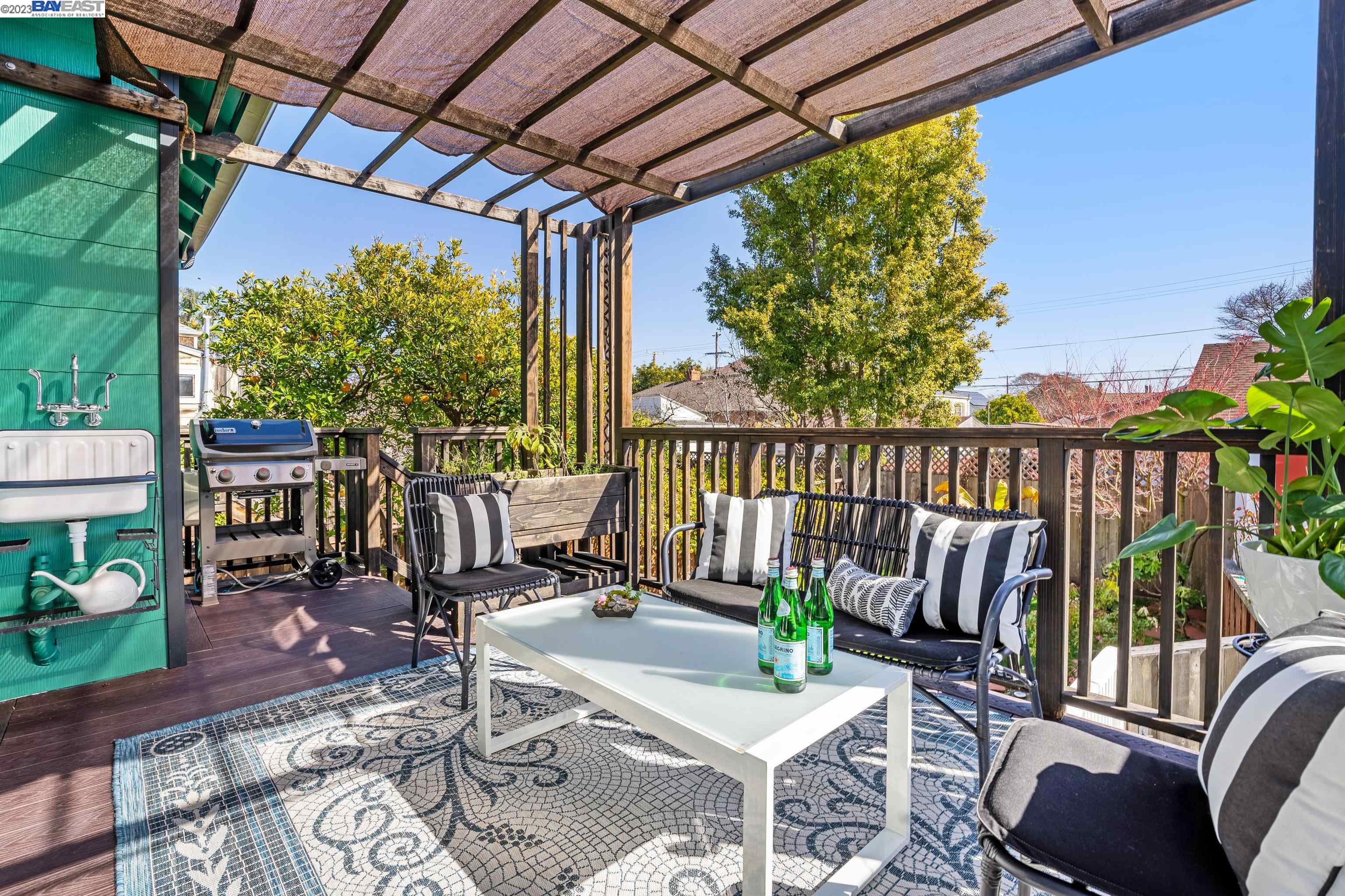 Undisclosed Address Alameda, CA 94501 - Photo 35 of 50 a view of a patio with a dining table and chairs with a patio