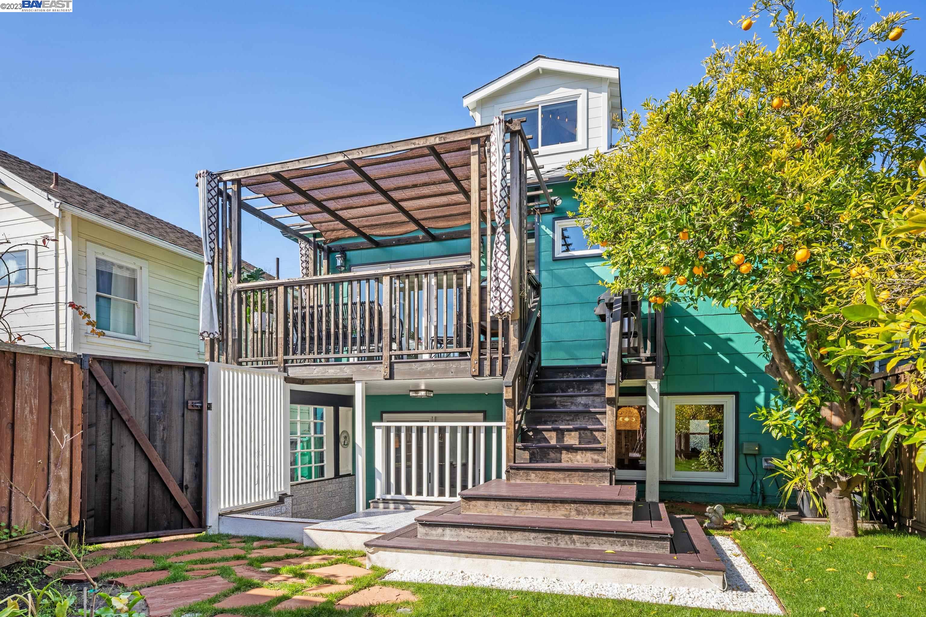 Undisclosed Address Alameda, CA 94501 - Photo 38 of 50 a front view of a house with a garden