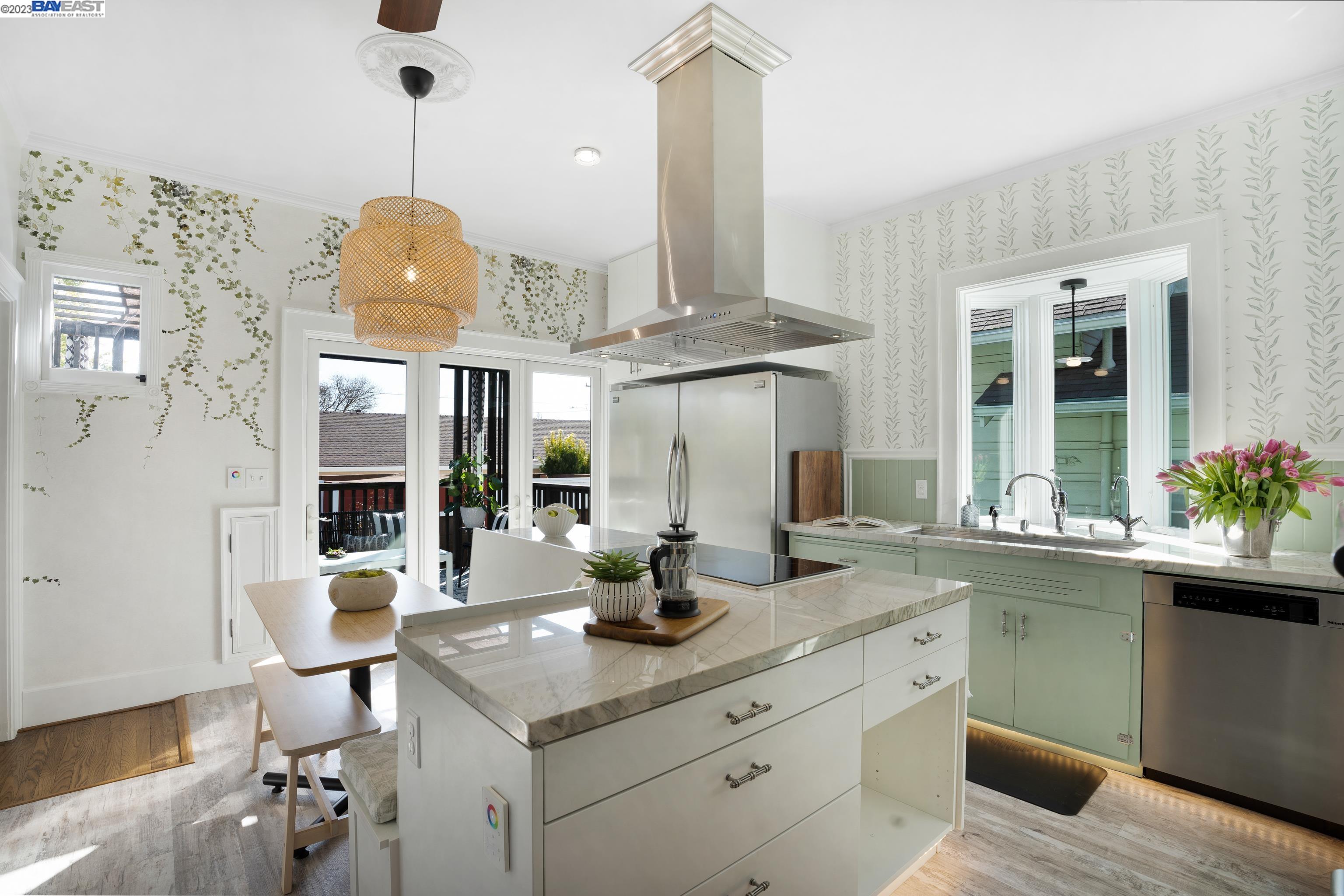 Undisclosed Address Alameda, CA 94501 - Photo 8 of 50 a kitchen with a sink dishwasher a dining table and chairs with wooden floor