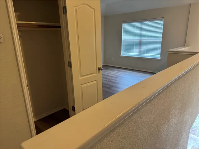 a view of a hallway with windows