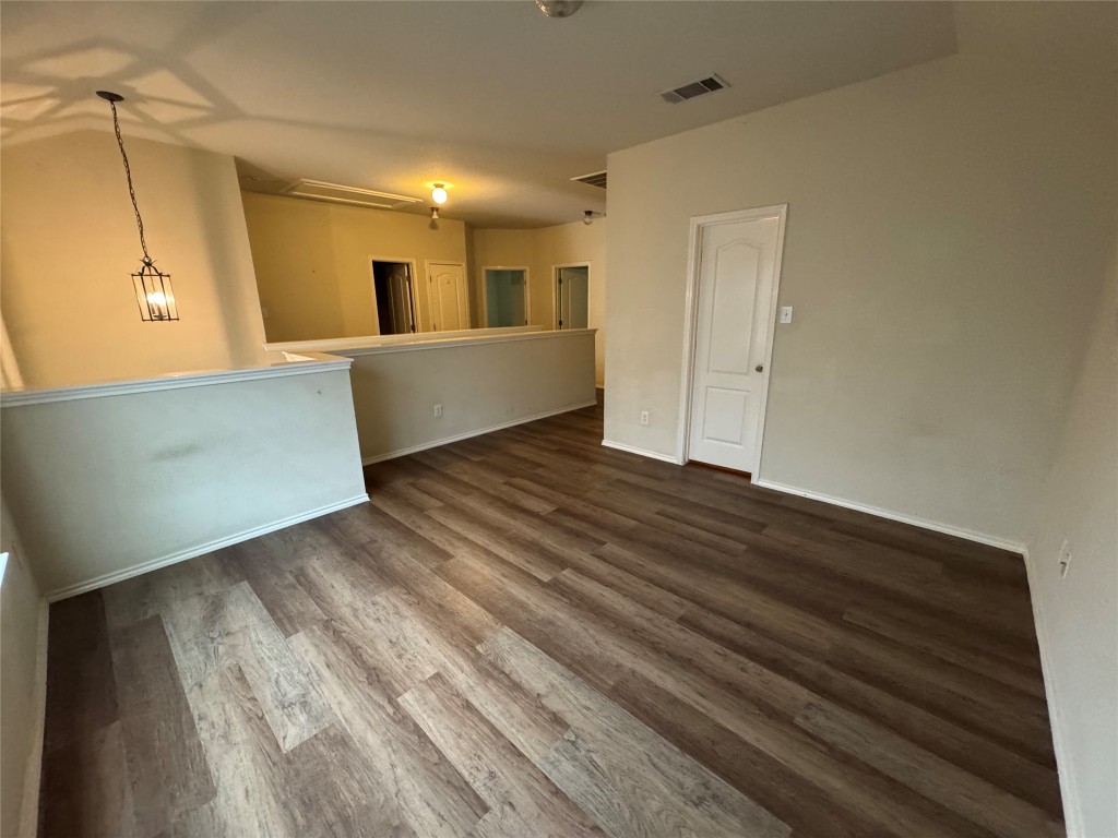 2053 Rachel Lane Round Rock, TX 78664 - Photo 15 of 37 a view of a big room with wooden floor and windows