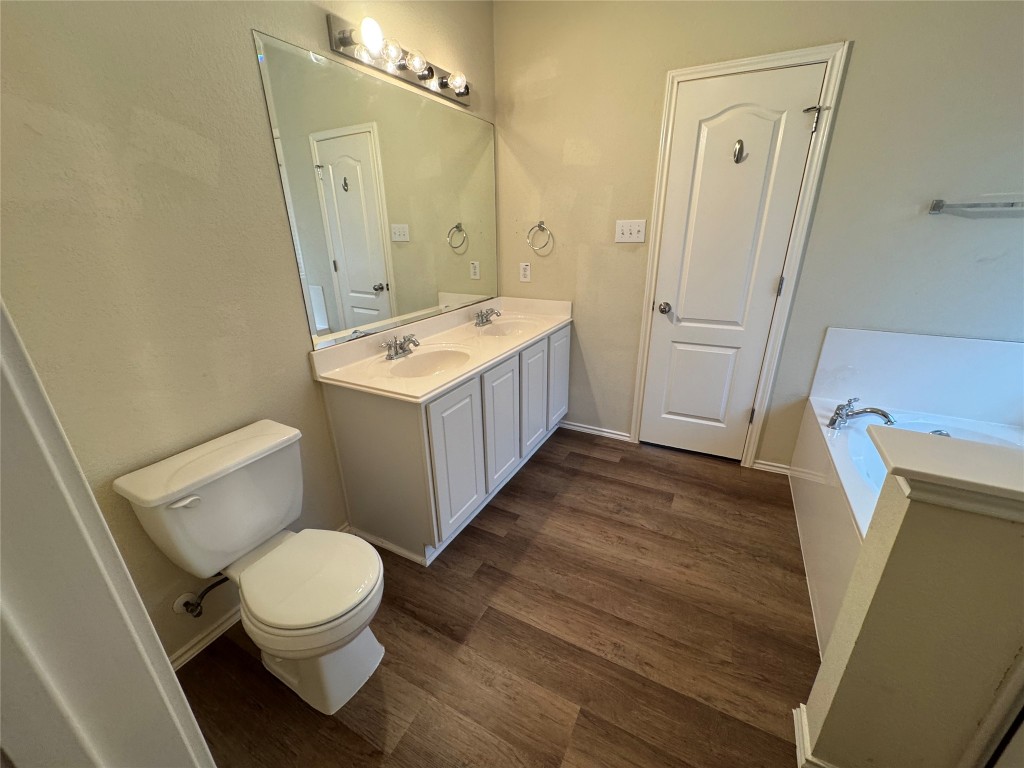 2053 Rachel Lane Round Rock, TX 78664 - Photo 29 of 37 a bathroom with a sink a toilet and shower