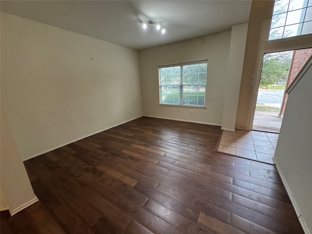 2053 Rachel Lane Round Rock, TX 78664 - Photo 3 of 37 an empty room with wooden floor and windows