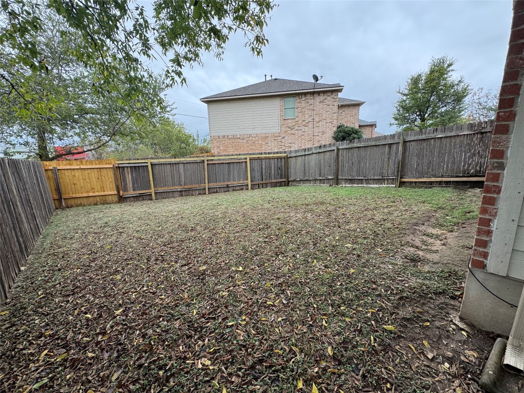 2053 Rachel Lane Round Rock, TX 78664 - Photo 34 of 37 a view of a backyard with wooden fence
