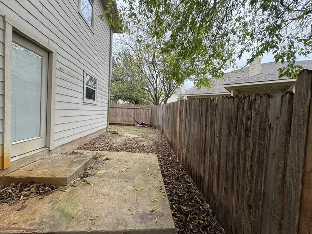 a view of a backyard with pathway