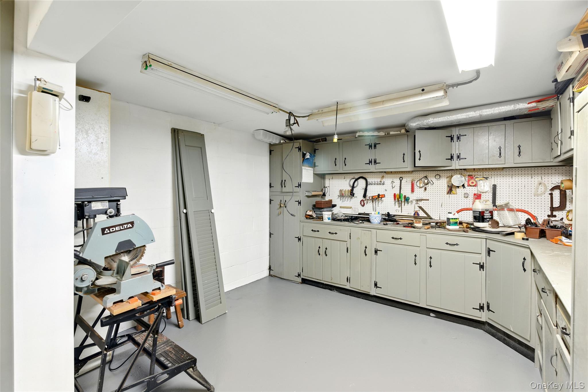2005 Westview Drive Mattituck, NY 11952 - Photo 41 of 45 a kitchen with granite countertop cabinets a sink and a stove