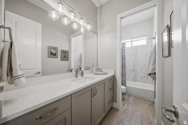 2829 East 1880th Street South St. George, UT 84790 - Photo 22 of 54 Bathroom featuring vanity, shower combination, and light wood-style floors