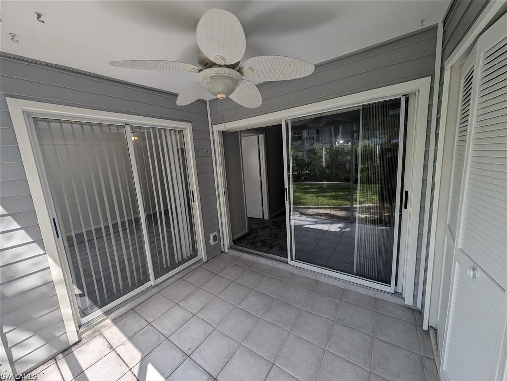 1915 Courtyard Way, Unit G102 Naples, FL 34112 - Photo 3 of 16 Screened lanai area, with washer & dryer closet