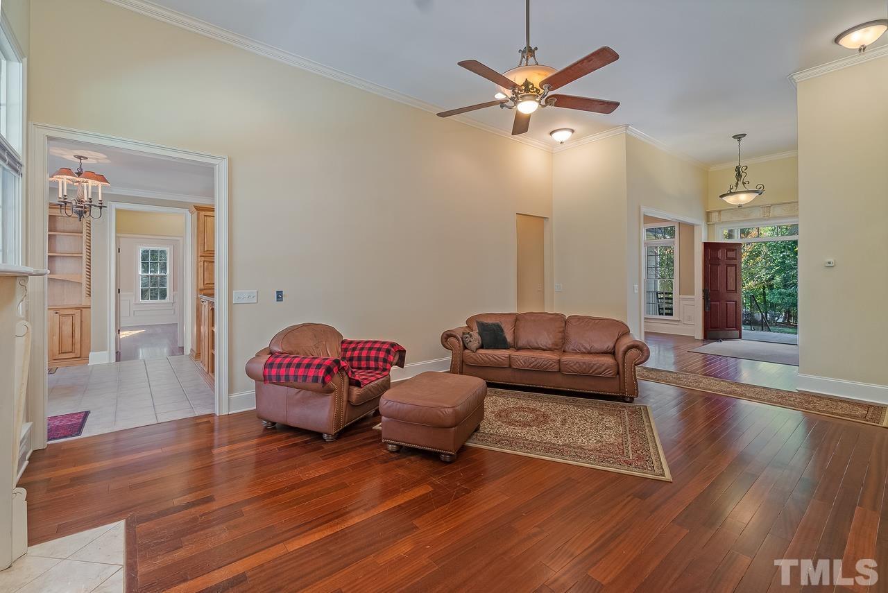 1313 Wynncrest Court Raleigh, NC 27603 - Photo 14 of 30 a living room with furniture and wooden floor