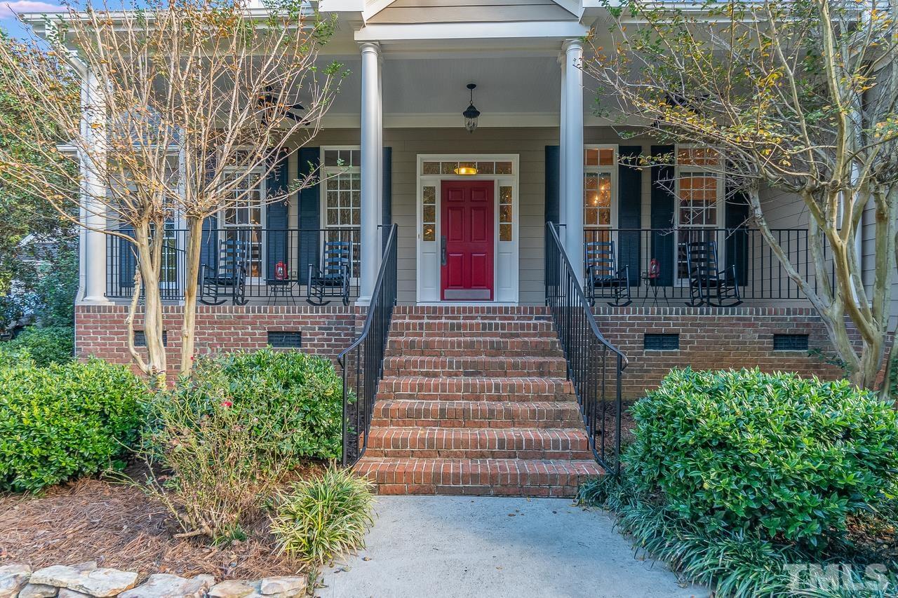 1313 Wynncrest Court Raleigh, NC 27603 - Photo 3 of 30 a front view of a house with a garden