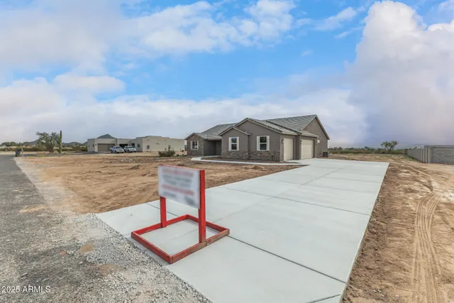 a living room with furniture a wooden floor and a window