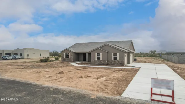 an aerial view of a house with outdoor space